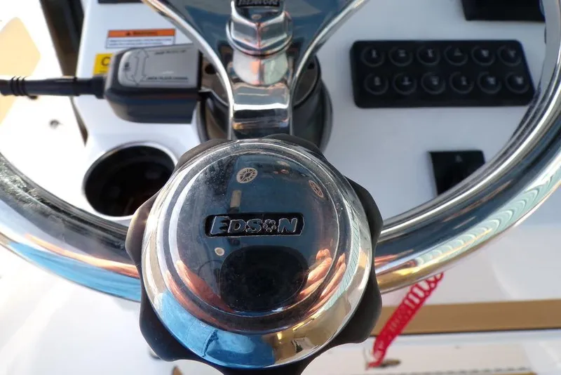 Slide: The Image of Steering wheel of 2025 Sportsman Masters 247 boat with Edson logo. - 43