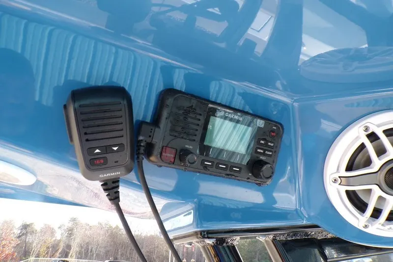 Slide: The Image of Garmin marine radio and speaker on 2025 Sportsman Masters 247 boat dashboard. - 44