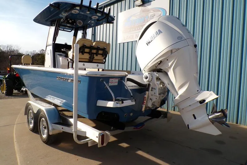 Slide: The Image of 2025 Sportsman Masters 247 boat with Yamaha engine on trailer, parked outdoors. - 5