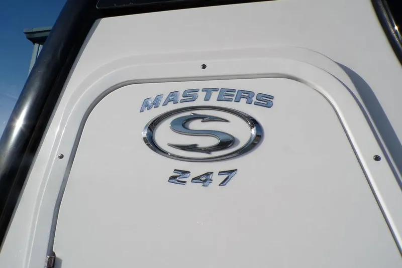 Slide: The Image of 2025 Sportsman Masters 247 boat emblem on white surface. - 7