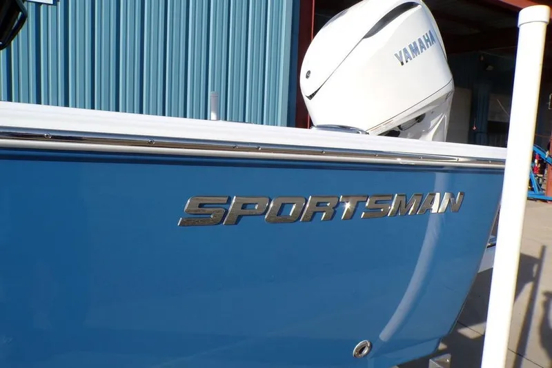 Slide: The Image of 2025 Sportsman Masters 247 boat with Yamaha engine, blue hull, and chrome lettering. - 8