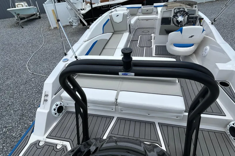 Slide: The Image of 2023 Starcraft SVX 231 OB DH boat interior with seating and steering console. - 12