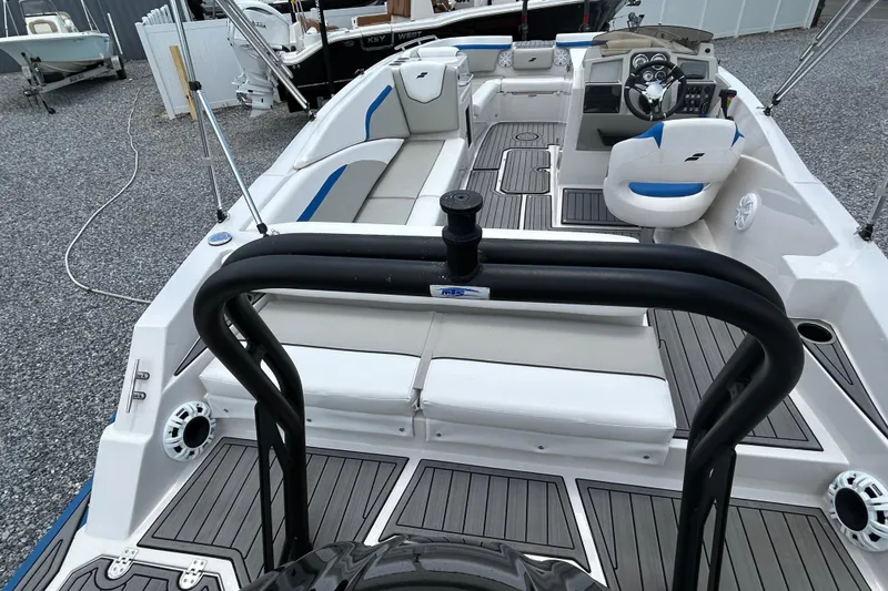 Slide: The Image of 2023 Starcraft SVX 231 OB DH boat interior with seating and steering console. - 13