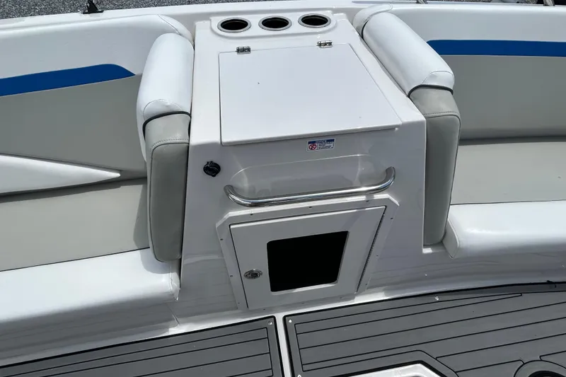 Slide: The Image of 2023 Starcraft SVX 231 OB DH boat interior with seating and storage compartment. - 18