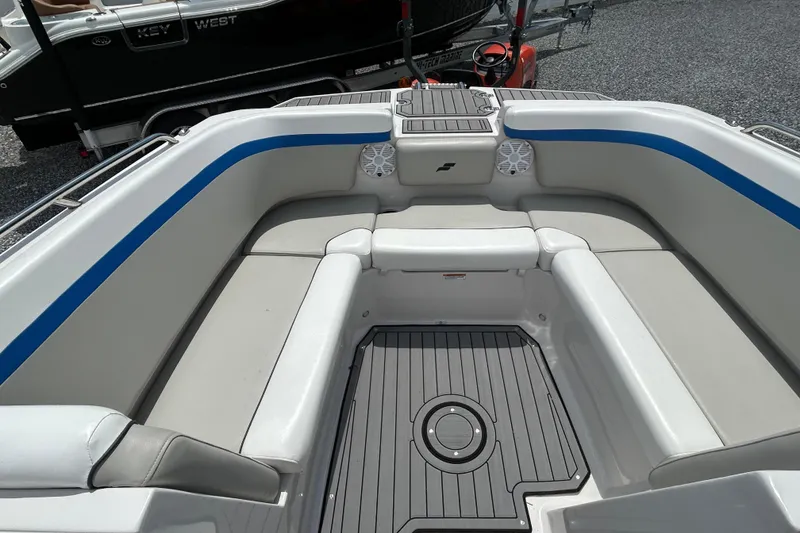 Slide: The Image of 2023 Starcraft SVX 231 OB DH boat interior with cushioned seating and modern design. - 24