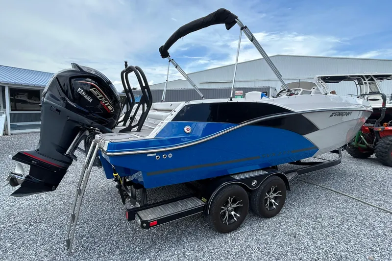 Slide: The Image of 2023 Starcraft SVX 231 OB DH boat with Yamaha engine on trailer. - 4