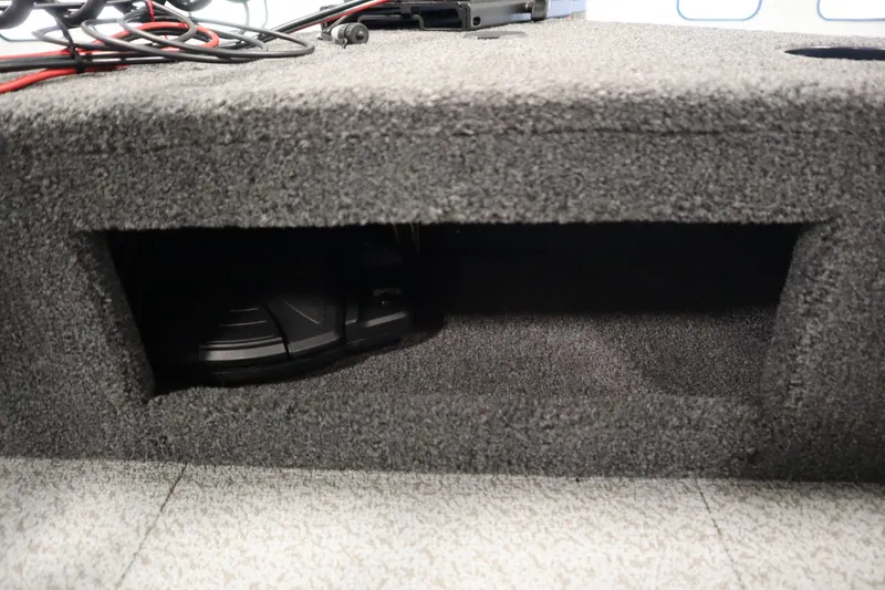 Slide: The Image of Carpeted storage compartment in 2026 Crestliner 1650 Hawk Side Console boat. - 14