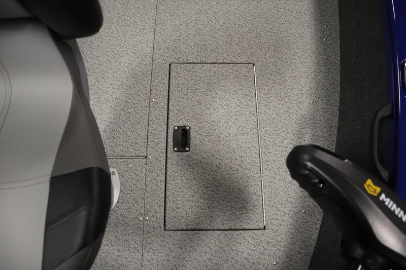 Slide: The Image of 2026 Crestliner 1650 Hawk Side Console boat interior with storage compartment and seating. - 16