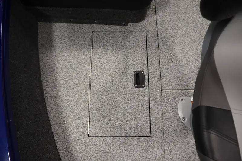 Slide: The Image of 2026 Crestliner 1650 Hawk Side Console boat interior with storage compartment. - 18