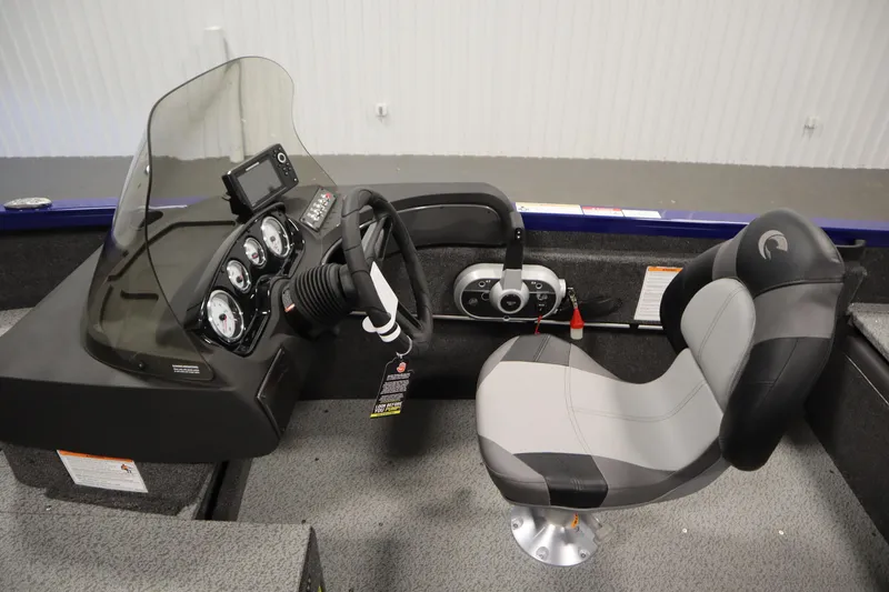 Slide: The Image of 2026 Crestliner 1650 Hawk Side Console interior with steering wheel and control panel. - 22