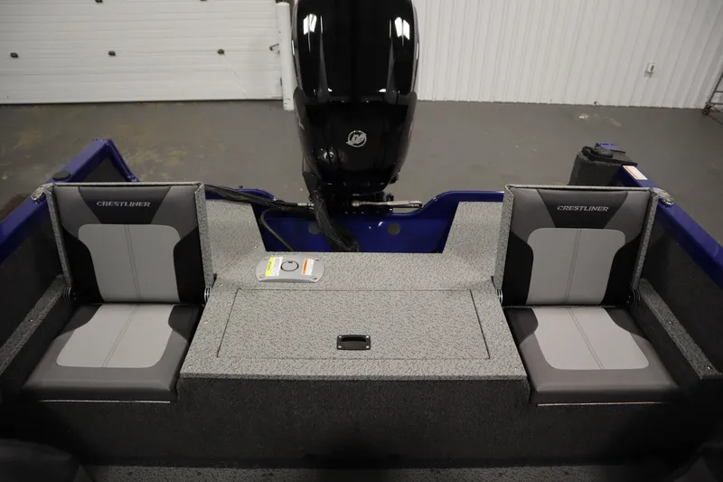 Slide: The Image of 2026 Crestliner 1650 Hawk Side Console boat interior with seating and motor. - 38