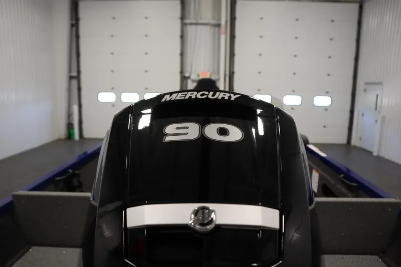 Slide: The Image of Mercury 90 outboard motor on 2026 Crestliner 1650 Hawk Side Console boat in garage. - 45