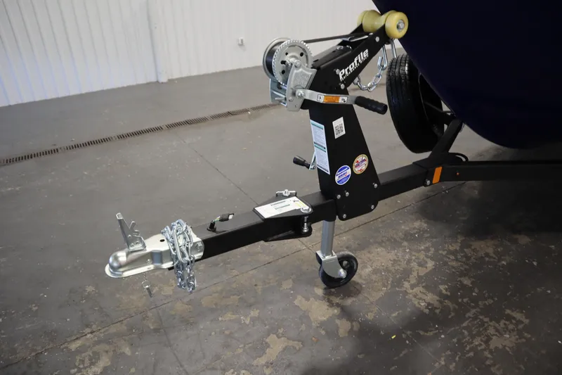 Slide: The Image of Trailer hitch of 2026 Crestliner 1650 Hawk Side Console boat in a garage setting. - 47