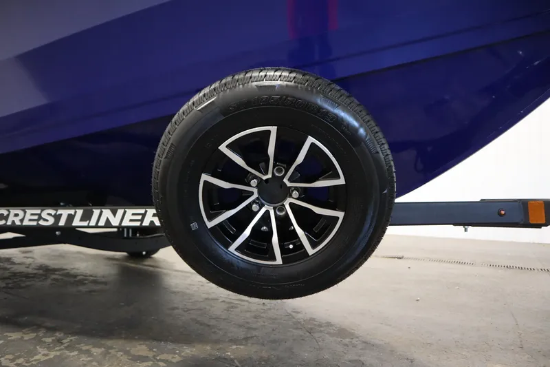 Slide: The Image of Trailer wheel of 2026 Crestliner 1650 Hawk Side Console boat, close-up view. - 48