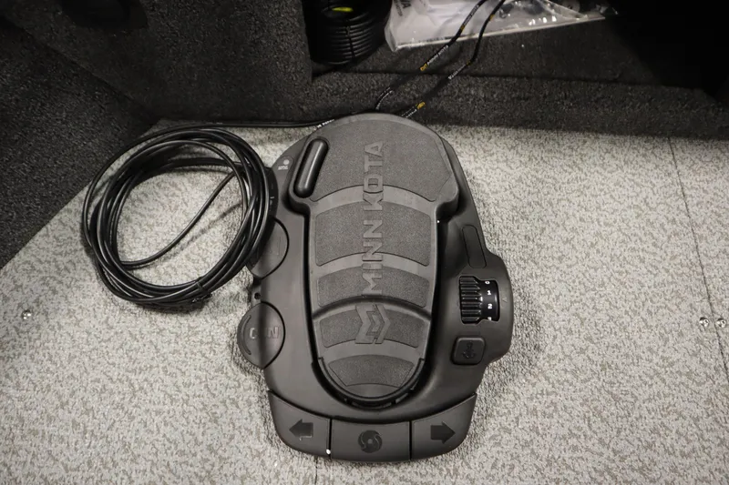 Slide: The Image of Minn Kota foot pedal on Crestliner 1750 Hawk Side Console, 2026 model, with coiled cable. - 13