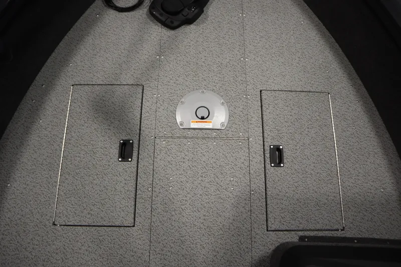 Slide: The Image of 2026 Crestliner 1750 Hawk Side Console boat deck with storage compartments. - 15