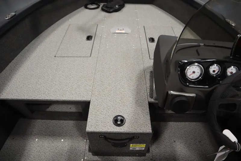 Slide: The Image of 2026 Crestliner 1750 Hawk Side Console interior with dashboard and storage compartments. - 17