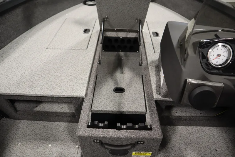 Slide: The Image of 2026 Crestliner 1750 Hawk Side Console interior with storage compartments and dashboard gauge. - 18