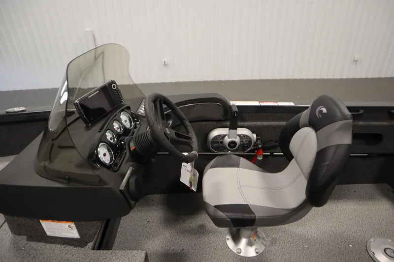 Slide: The Image of 2026 Crestliner 1750 Hawk Side Console interior with steering wheel and dashboard controls. - 19