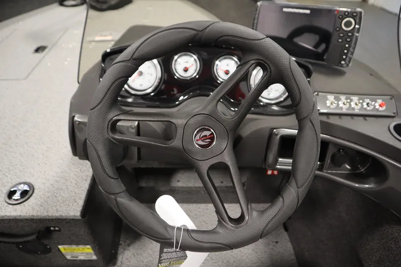 Slide: The Image of 2026 Crestliner 1750 Hawk Side Console dashboard with steering wheel and control panel. - 21