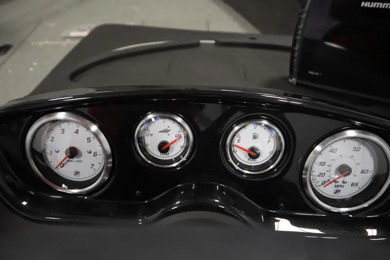 Slide: The Image of Dashboard of 2026 Crestliner 1750 Hawk Side Console with gauges for RPM, fuel, trim, and speed. - 22
