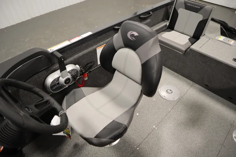 Slide: The Image of 2026 Crestliner 1750 Hawk Side Console interior with steering wheel and seating. - 28