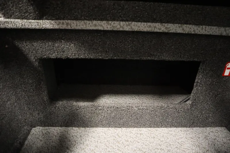 Slide: The Image of Interior storage compartment of 2026 Crestliner 1750 Hawk Side Console boat. - 30