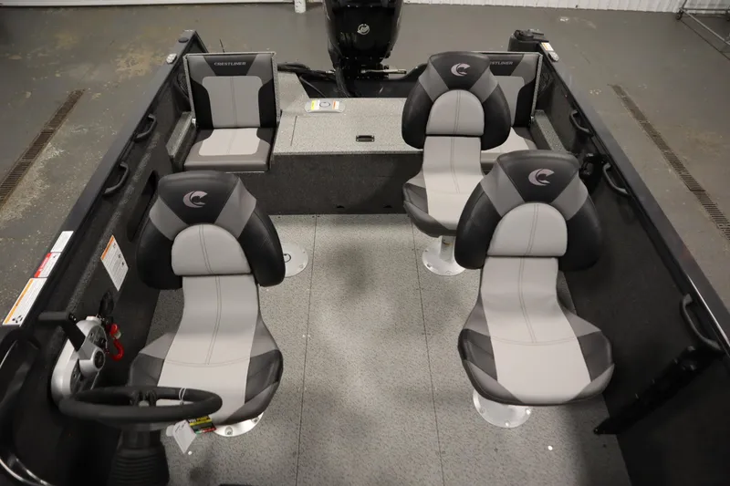 Slide: The Image of 2026 Crestliner 1750 Hawk Side Console interior with four gray and black seats. - 33
