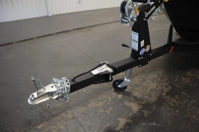 Slide: The Image of Trailer hitch of 2026 Crestliner 1750 Hawk Side Console boat in a garage setting. - 41