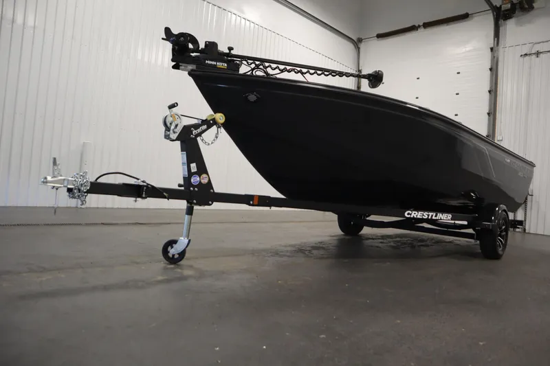 Slide: The Image of 2026 Crestliner 1750 Hawk Side Console boat on trailer in indoor setting. - 42