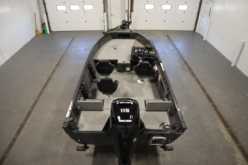 Slide: The Image of 2026 Crestliner 1750 Hawk Side Console boat in a garage, featuring a 115 Mercury engine. - 9