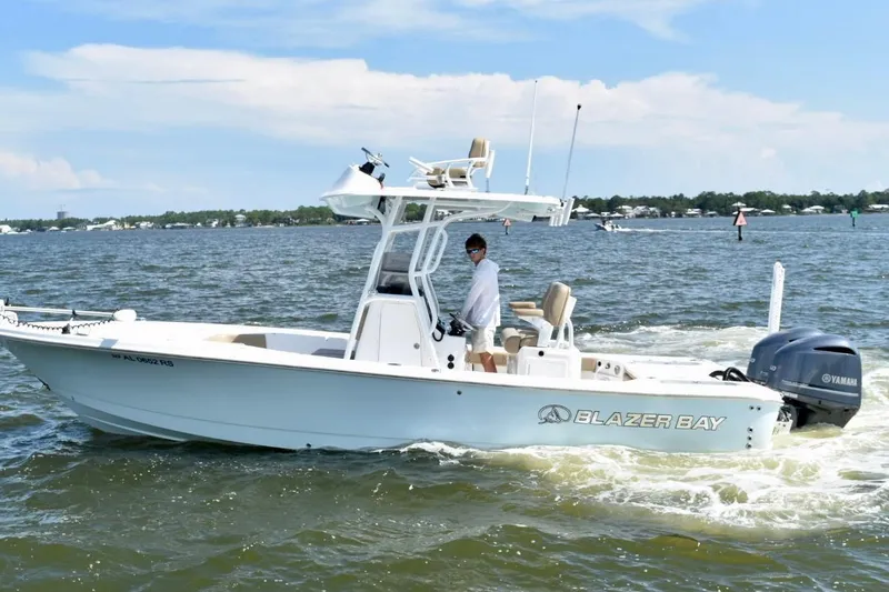The Image of 2021 Blazer Bay 2700 Hybrid Bay boat cruising on open water. - 0