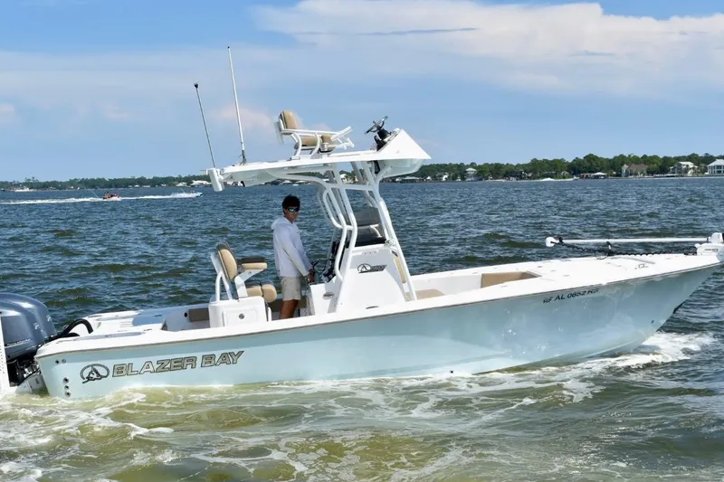 Slide: The Image of 2021 Blazer Bay 2700 Hybrid Bay boat cruising on a sunny day. - 3
