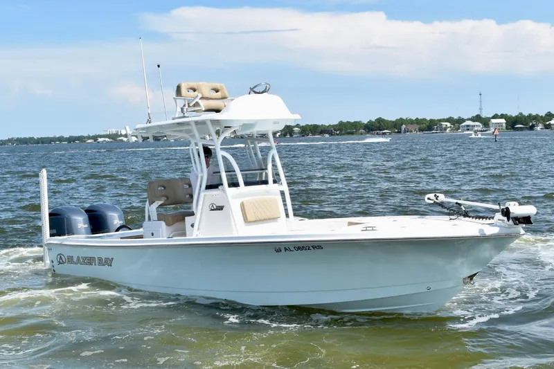 Slide: The Image of 2021 Blazer Bay 2700 Hybrid Bay boat cruising on a sunny day. - 4