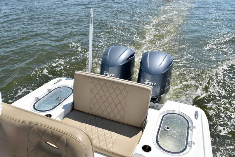 Slide: The Image of 2021 Blazer Bay 2700 Hybrid Bay boat with dual 250 engines on water. - 8