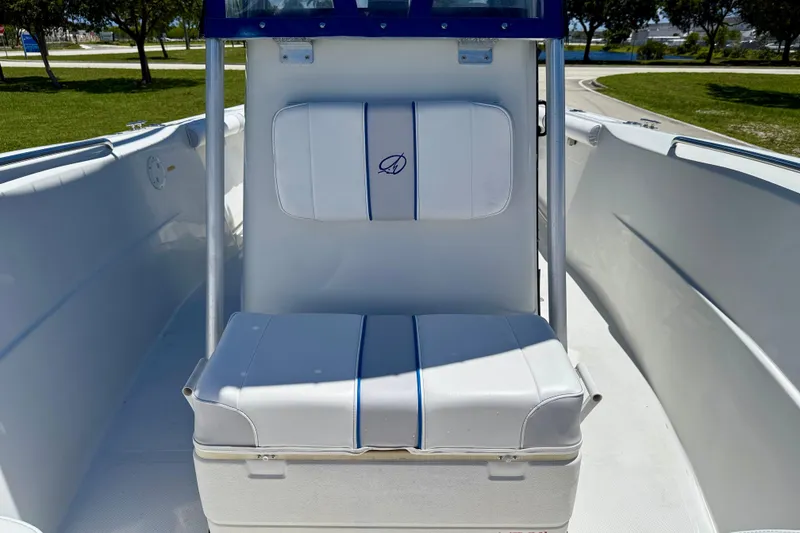 Slide: The Image of 2003 Sailfish 266 CC boat interior with cushioned seating and sleek design. - 11