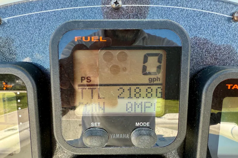 Slide: The Image of Close-up of a 2003 Sailfish 266 CC fuel gauge display showing 0 gph. - 19