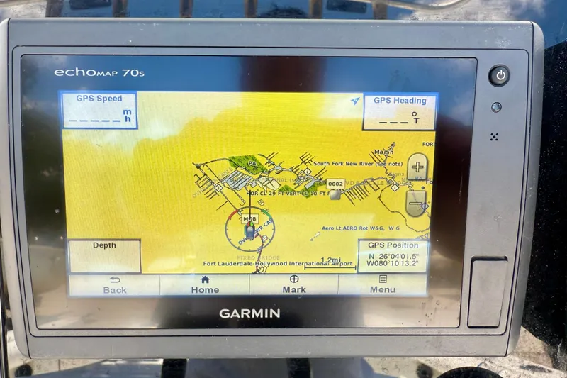 Slide: The Image of Garmin GPS display on 2003 Sailfish 266 CC, showing Fort Lauderdale map and coordinates. - 21