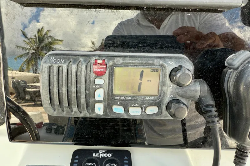 Slide: The Image of VHF marine radio on 2003 Sailfish 266 CC boat dashboard. - 23