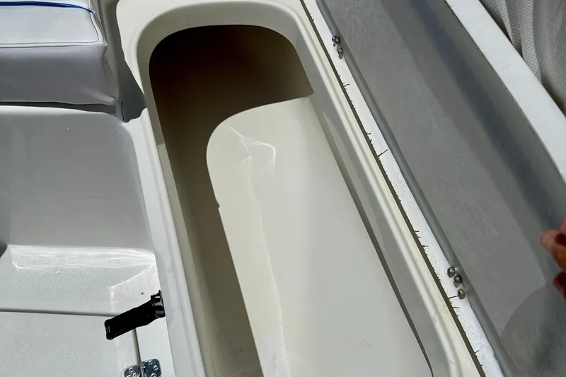 Slide: The Image of Open storage compartment on 2003 Sailfish 266 CC boat, showcasing interior details. - 33