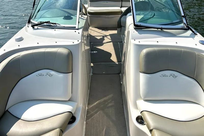 Slide: The Image of 2006 Sea Ray 240 Sundeck interior with comfortable seating and open deck layout. - 36
