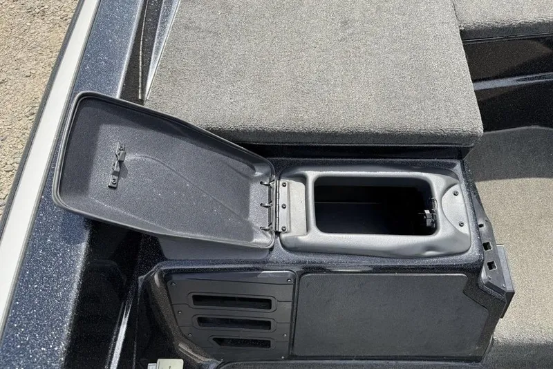 Slide: The Image of 2016 Skeeter ZX250 boat storage compartment with open lid, showcasing interior space. - 10
