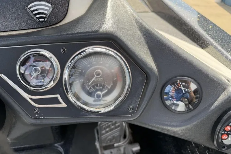 Slide: The Image of Dashboard of a 2016 Skeeter ZX250 boat with gauges and controls. - 11