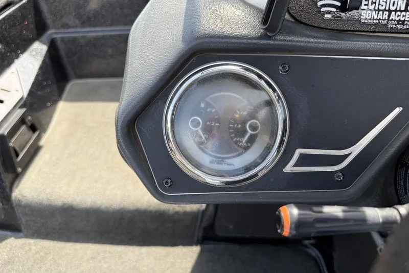 Slide: The Image of Dashboard of a 2016 Skeeter ZX250 boat with gauge and controls. - 13