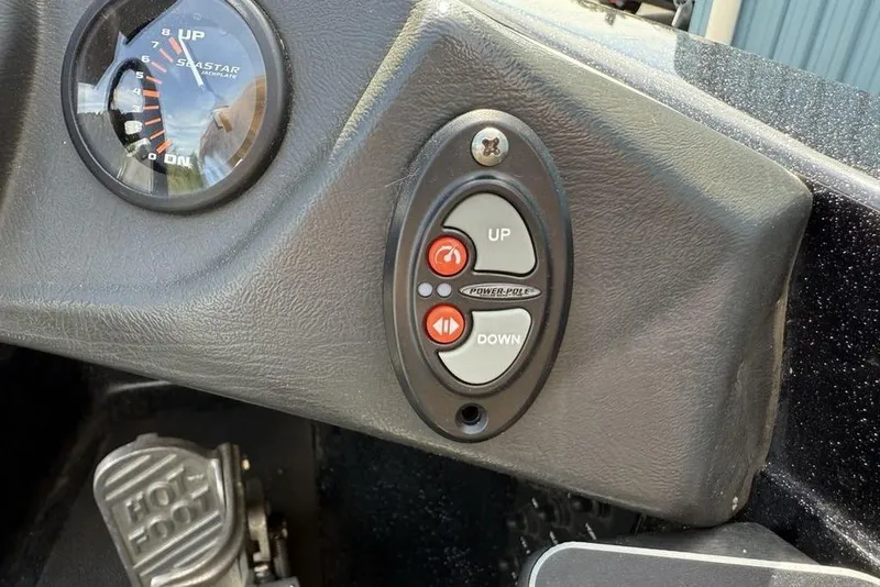 Slide: The Image of Control panel of 2016 Skeeter ZX250 boat with Power-Pole buttons and gauge. - 16