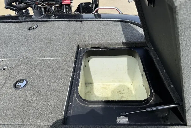 Slide: The Image of 2016 Skeeter ZX250 boat storage compartment with open hatch, showcasing interior space. - 25