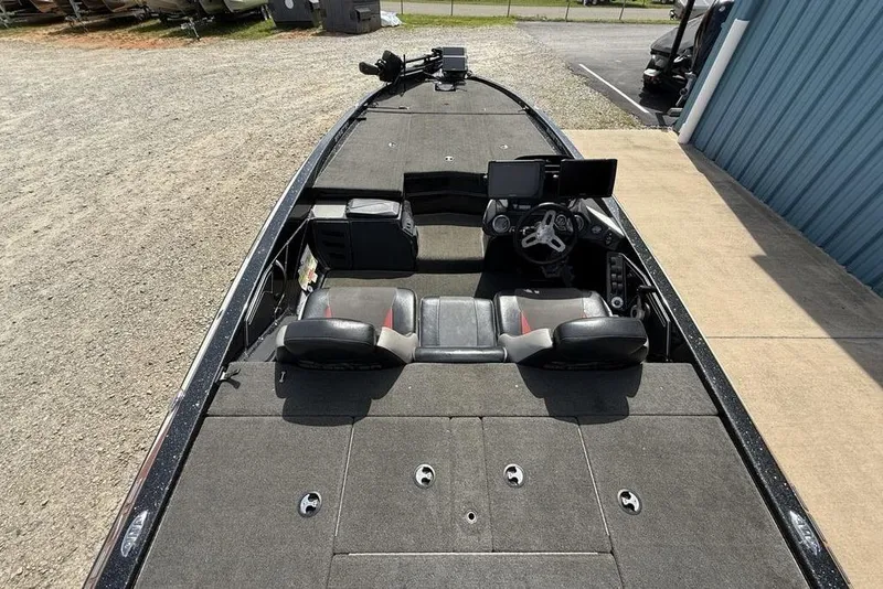 Slide: The Image of 2016 Skeeter ZX250 boat interior with dual seats and steering console. - 26