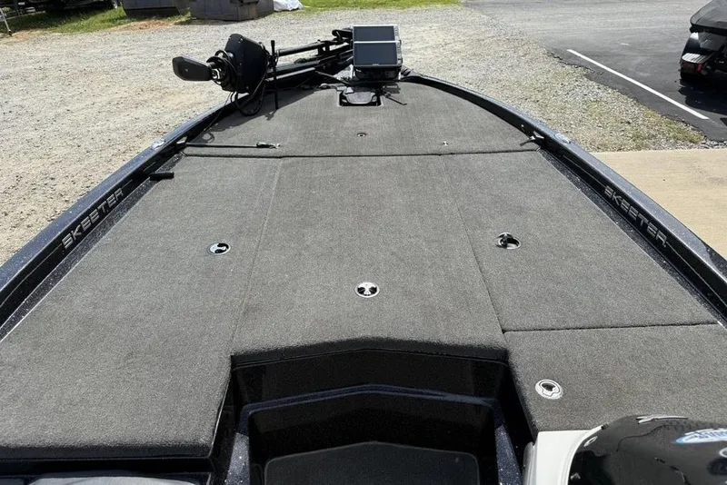 Slide: The Image of 2016 Skeeter ZX250 boat deck with trolling motor and storage compartments. - 6