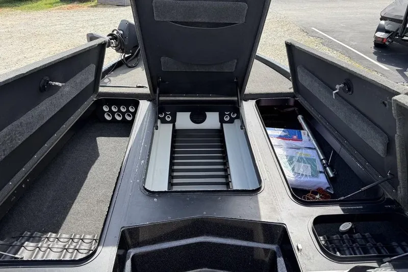 Slide: The Image of 2016 Skeeter ZX250 boat interior with open storage compartments and organized gear. - 7