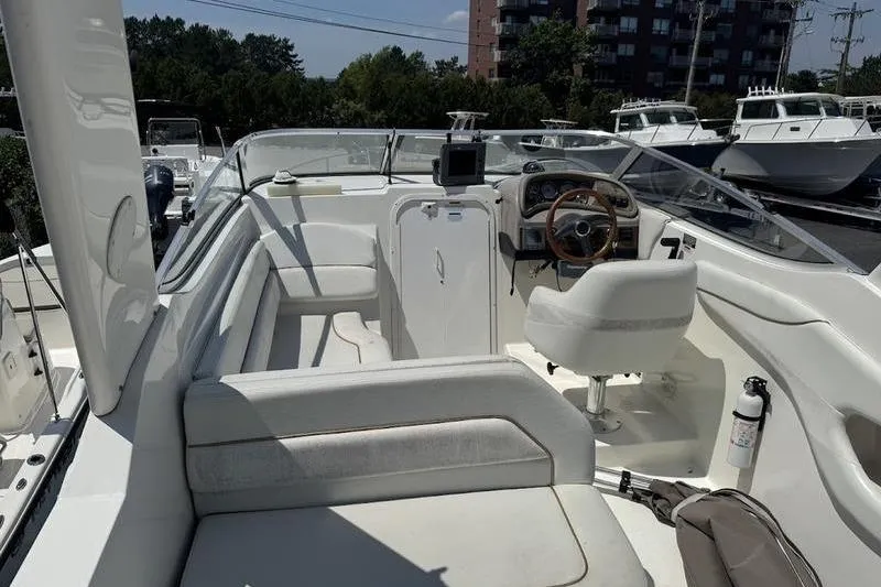 Slide: The Image of 2000 Weldcraft 26 Martinque boat interior with seating and steering wheel. - 12